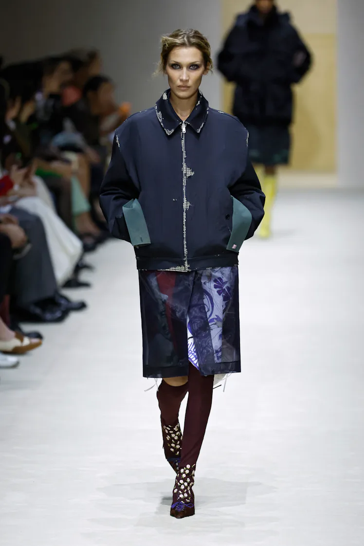 MILAN, ITALY - FEBRUARY 26: A model walks the runway at the Prada fashion show during the Milan Fash...