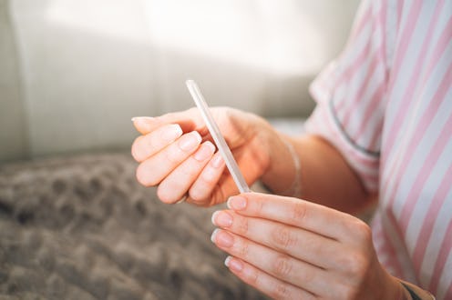 Women's hands doing manicure at home