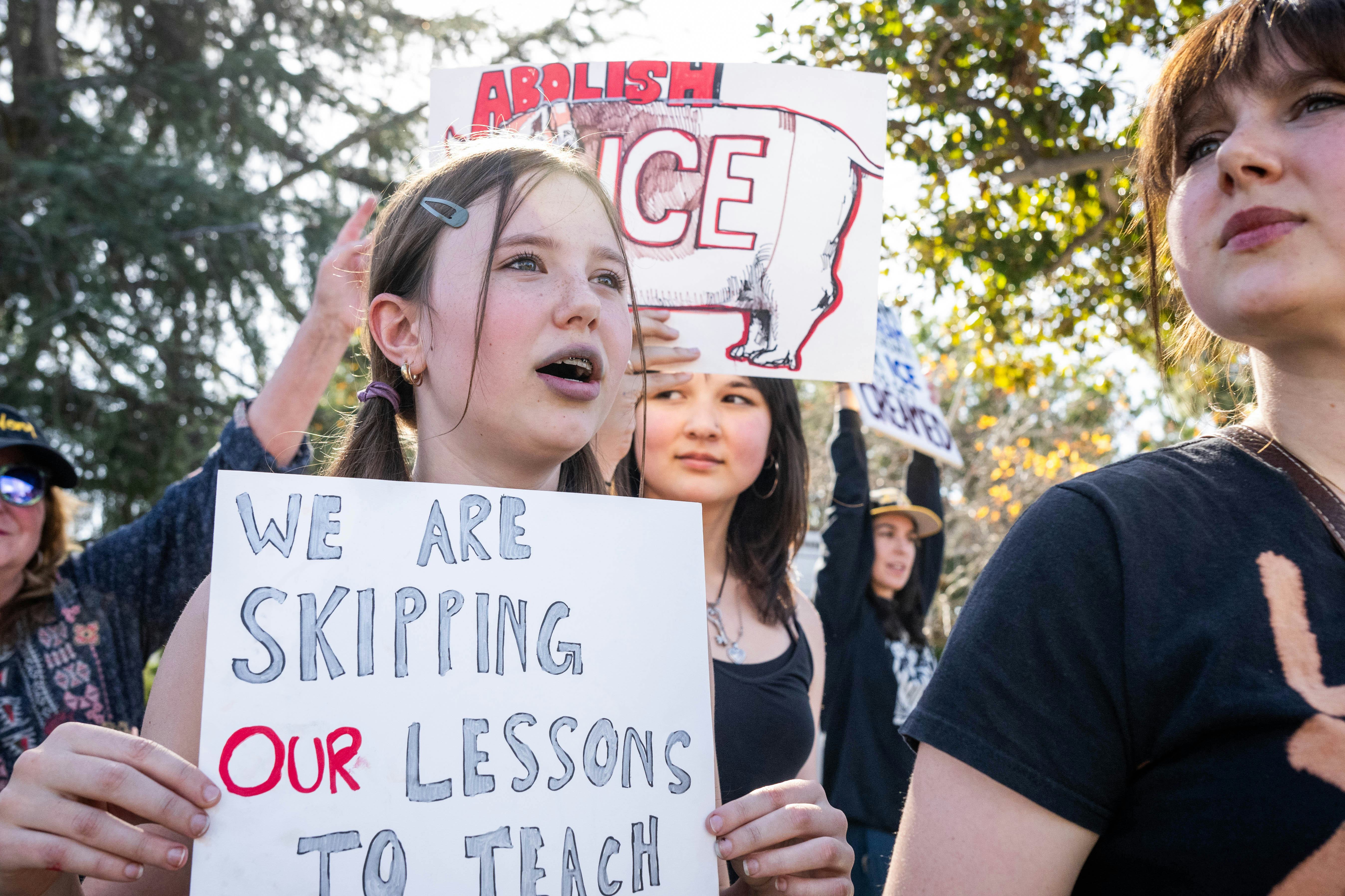 Augusta Cummins, 13, Robin Stromvall, 14, and Priscilla Cummins, 15, skip school to join a nationwid...