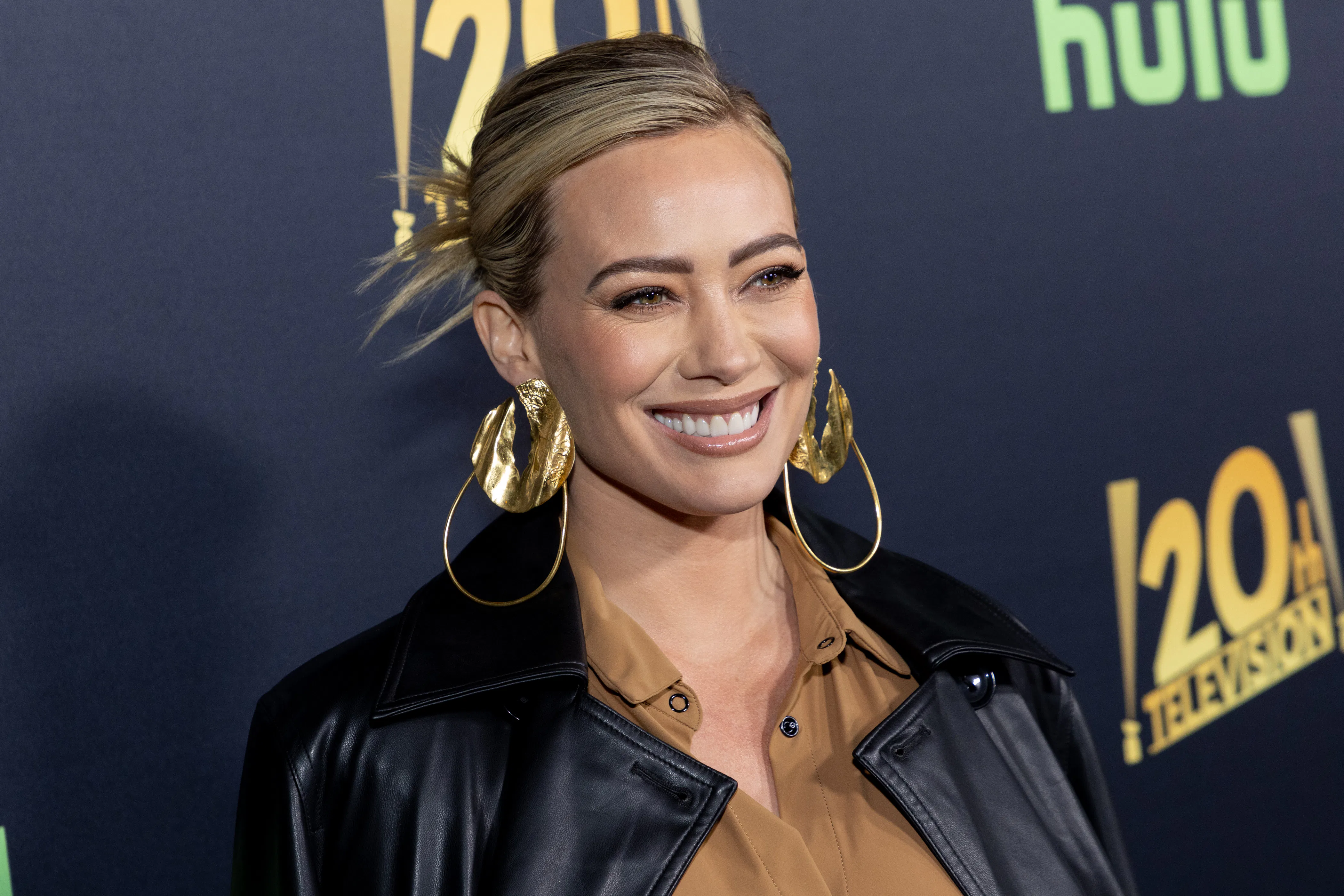 Hilary Duff with a slicked back spiky bun