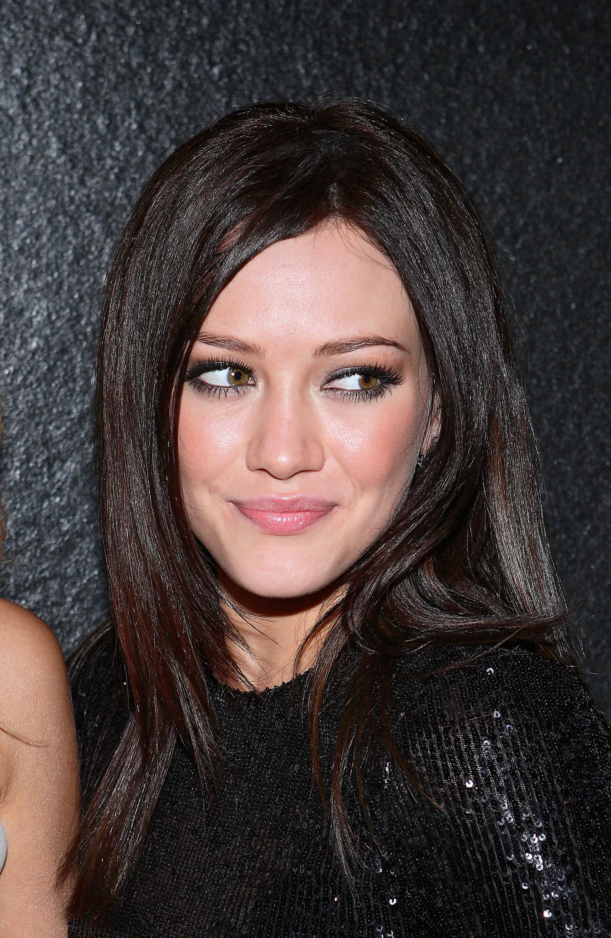 Hilary Duff with dark hair and bangs