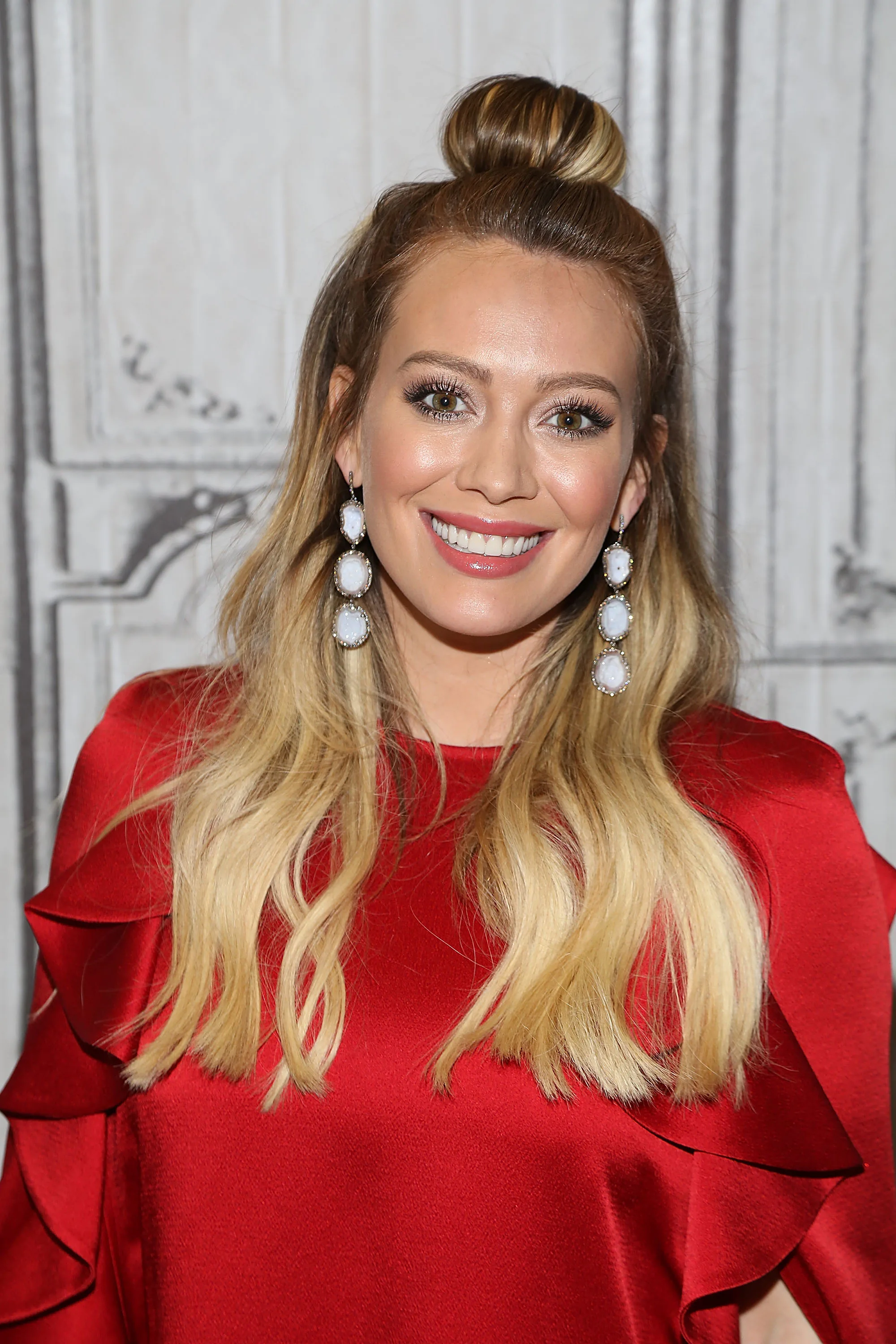 Hilary Duff with a half up, half down bun hairstyle
