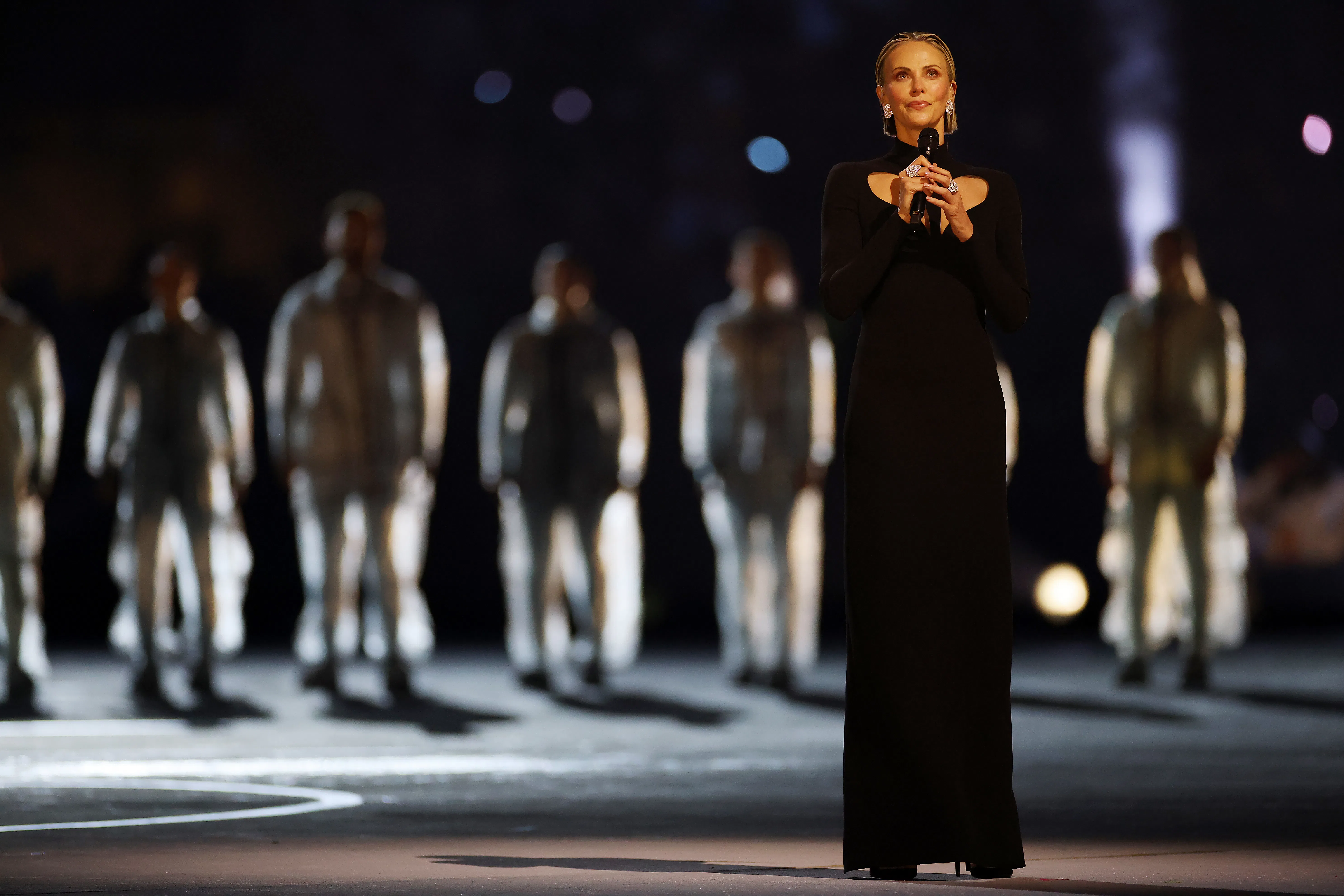 Charlize Theron delivers a speech during the opening ceremony of the Milano Cortina 2026 Winter Olym...