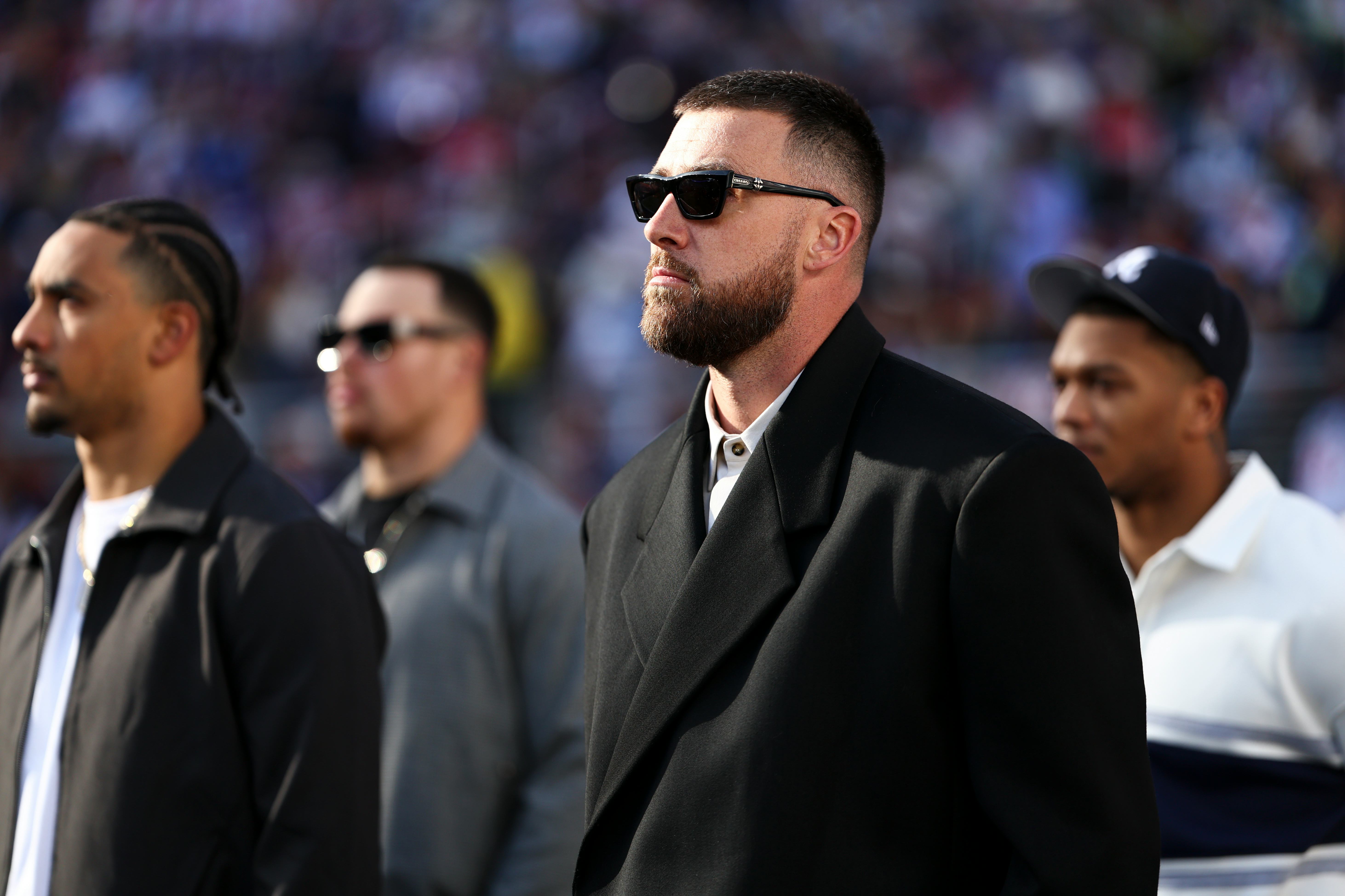 SANTA CLARA, CALIFORNIA - FEBRUARY 8: Travis Kelce #87 of the Kansas City Chiefs stands on the field...