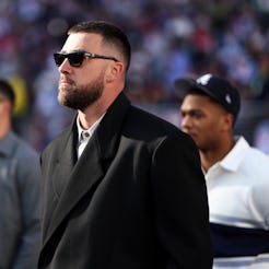 SANTA CLARA, CALIFORNIA - FEBRUARY 8: Travis Kelce #87 of the Kansas City Chiefs stands on the field...