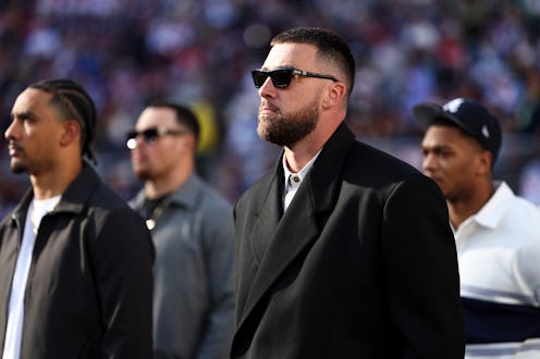 SANTA CLARA, CALIFORNIA - FEBRUARY 8: Travis Kelce #87 of the Kansas City Chiefs stands on the field...