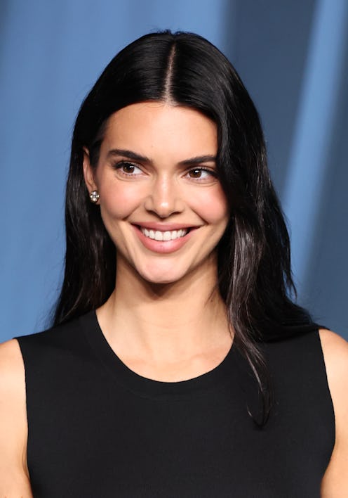 Kendall Jenner’s Super Bowl outfit included a tie-up crop top and jeans.