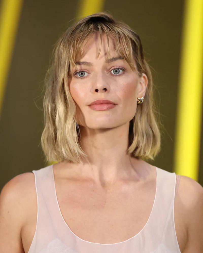 Margot Robbie with a bob with bangs