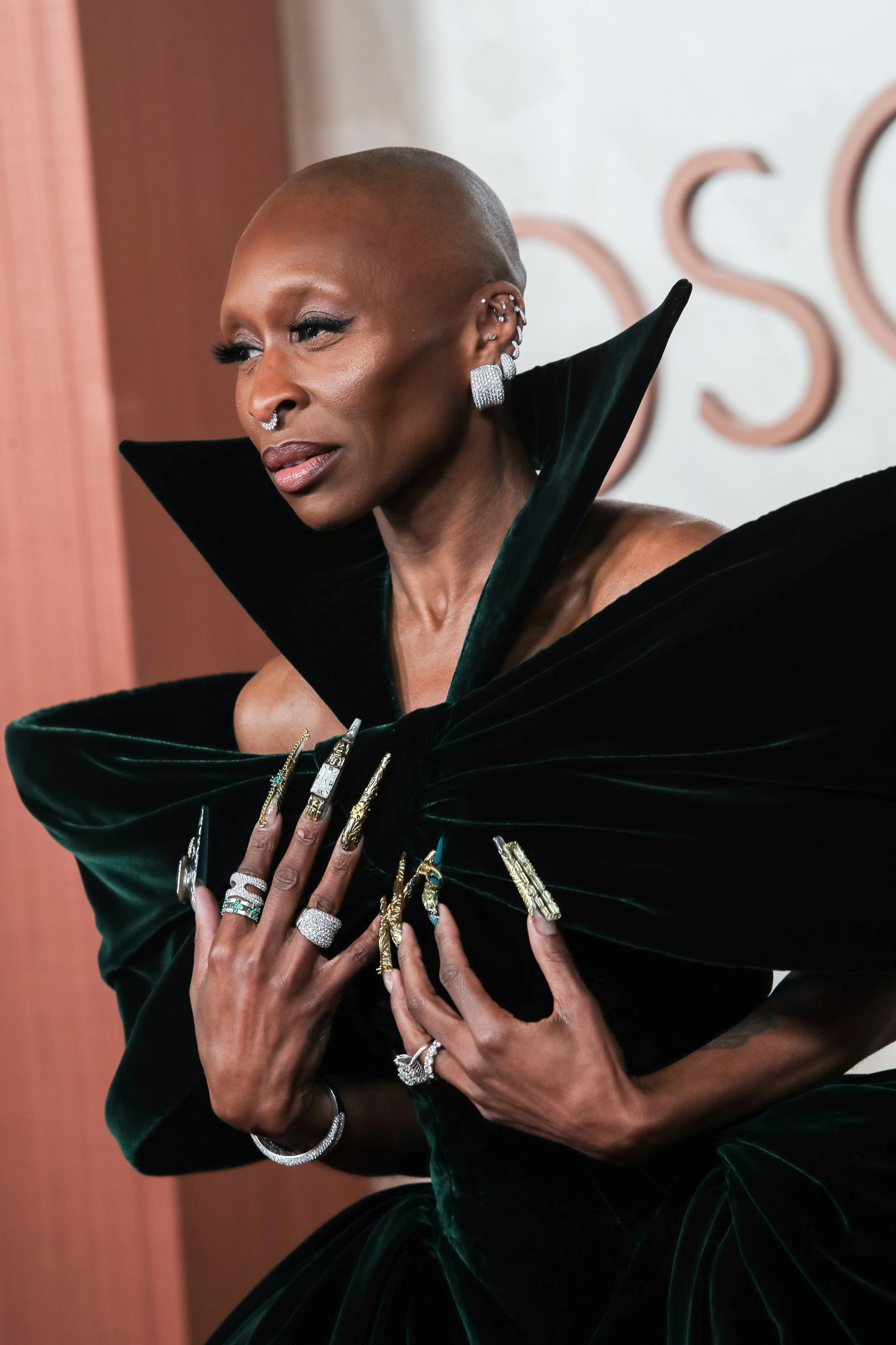 Cynthia Erivo at the 97th Oscars with an intricate and elaborate green and gold manicure