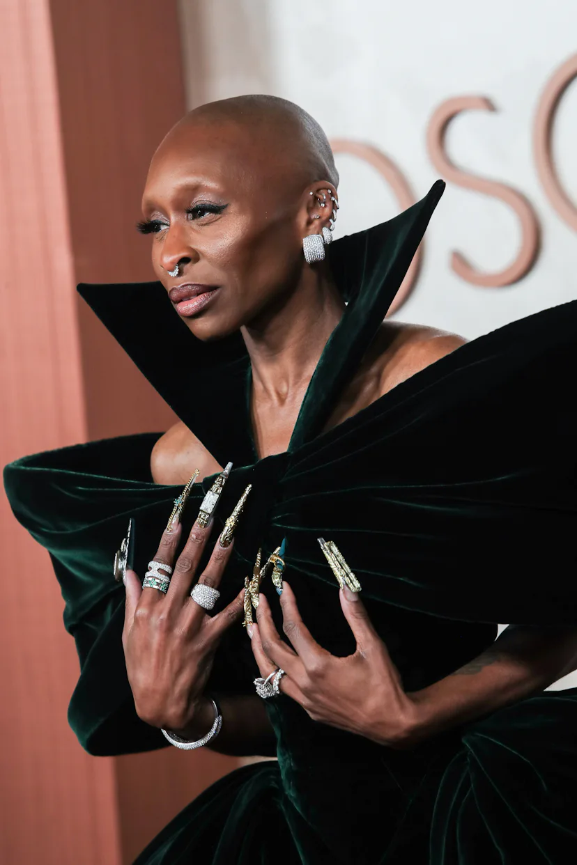 Cynthia Erivo at the 97th Oscars with an intricate and elaborate green and gold manicure