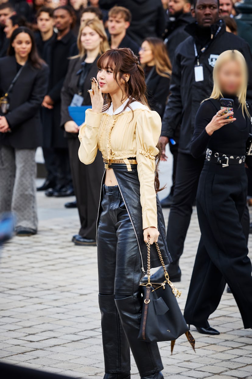 PARIS, FRANCE - MARCH 10: Lisa of BLACKPINK attends the Louis Vuitton show during Paris Fashion Week...