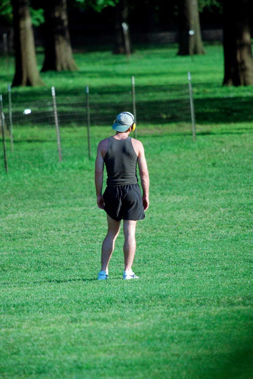 John Kennedy Jr. stretching and exercising in short in Central Park, June 4, 1998. (Photo by Lawrenc...