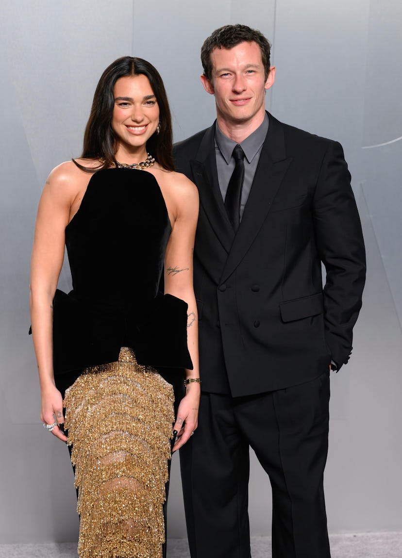 LOS ANGELES, CALIFORNIA - MARCH 15: (L-R) Dua Lipa and Callum Turner attend the 2026 Vanity Fair Osc...