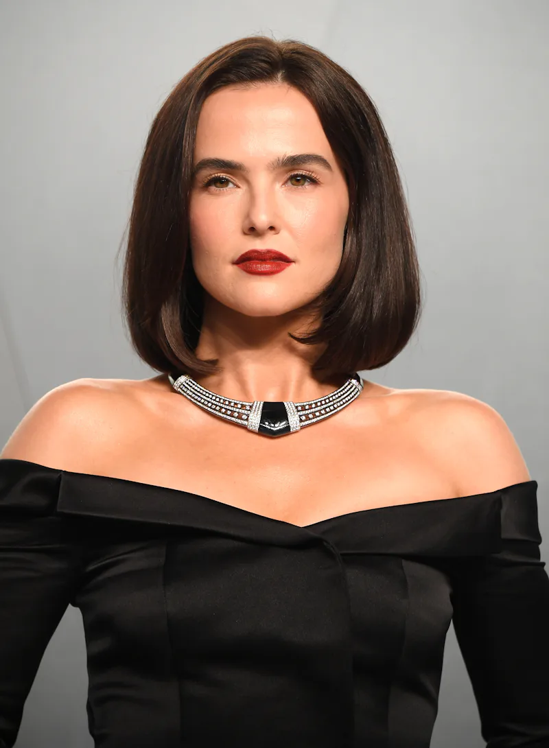 Zoey Deutch with a rich brown lob