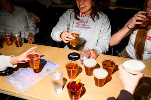 WASHINGTON, DC - FEBRUARY 24: A group of friends including Cassandra Marilley, center, stockpiles be...