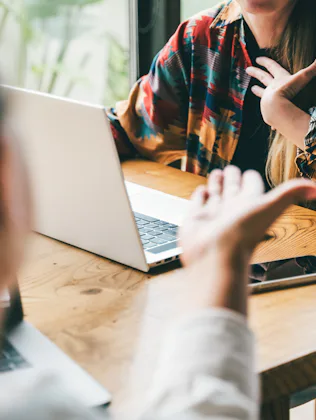 Two colleagues in the middle of a dynamic brainstorm or a lively discussion, an argument, gesturing ...