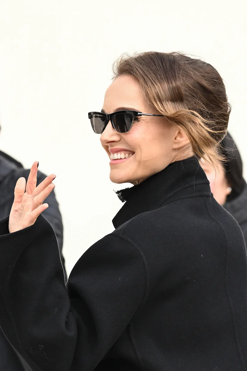 Natalie Portman at Paris Fashion Week wearing a French Twist