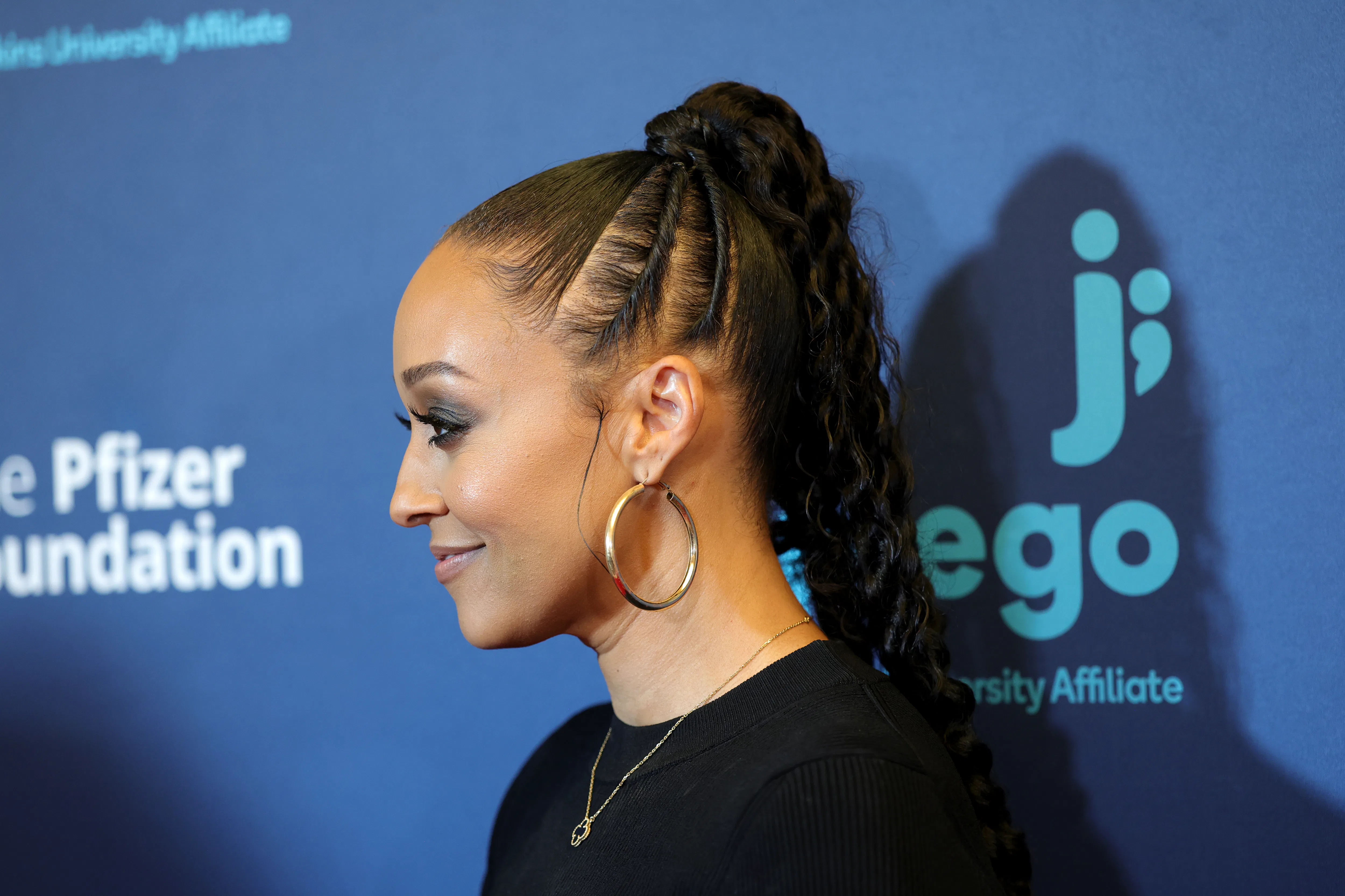 Tia Mowry with flat twists on the side of her ponytail