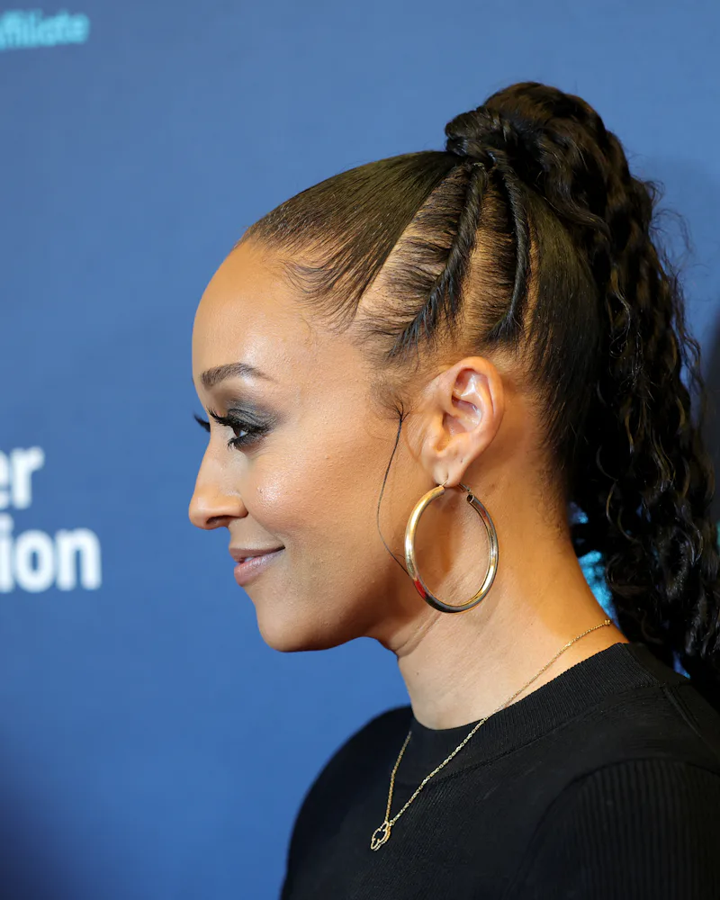 Tia Mowry with flat twists on the side of her ponytail