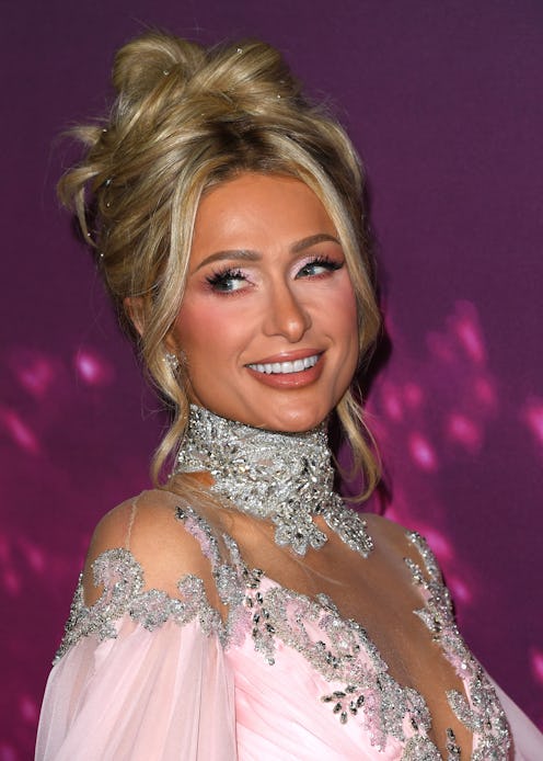 Paris Hilton with buttery blonde hair in an updo