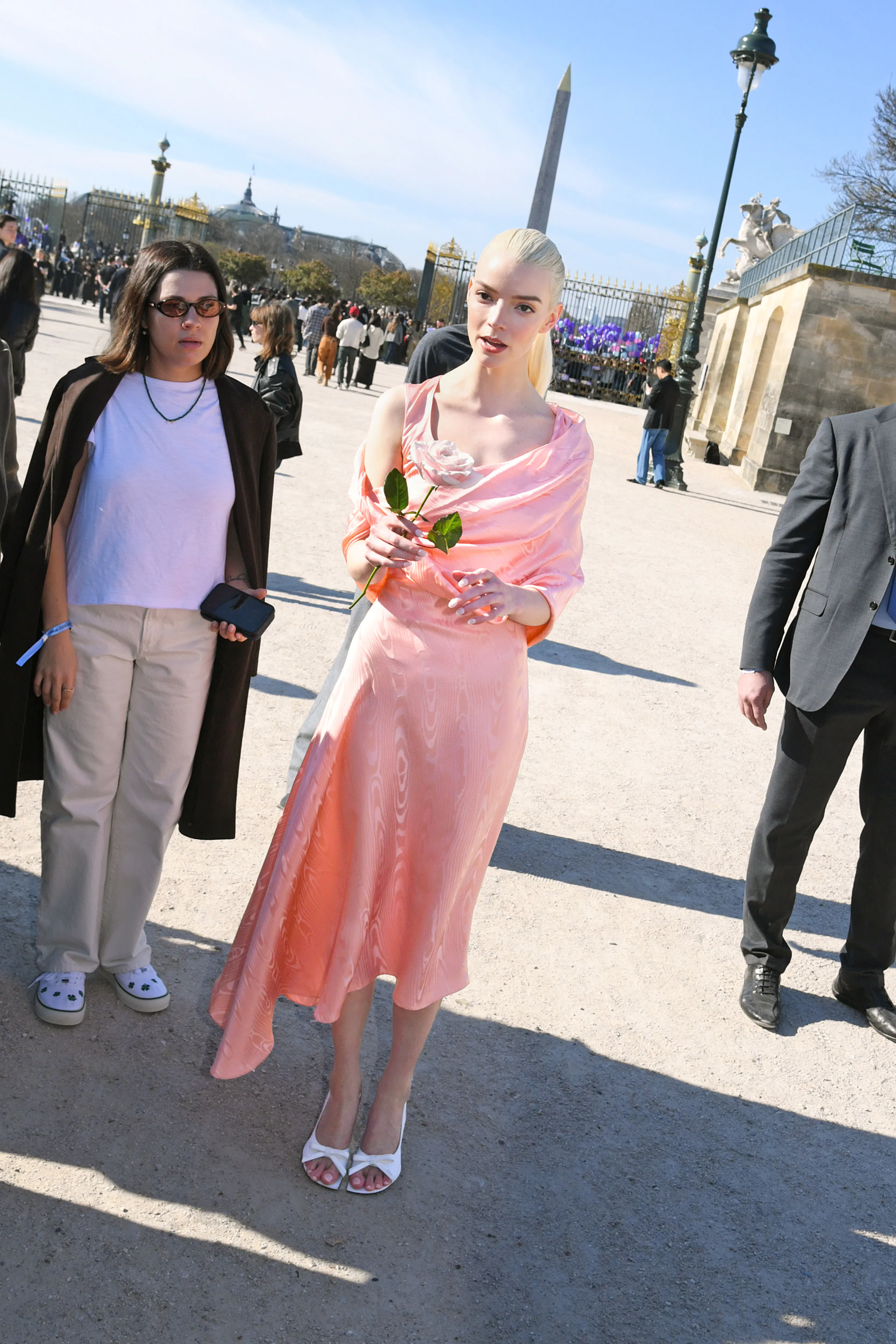 anya taylor-joy pink dress Anya Taylor-Joy wore a custom Jacquemus design from the Le Palmier  collection, reaffirming the label's minimalist and structural aesthetic.  The blush-toned ensemble paired a strapless top with a mermaid-silhouette  skirt, complemented by
