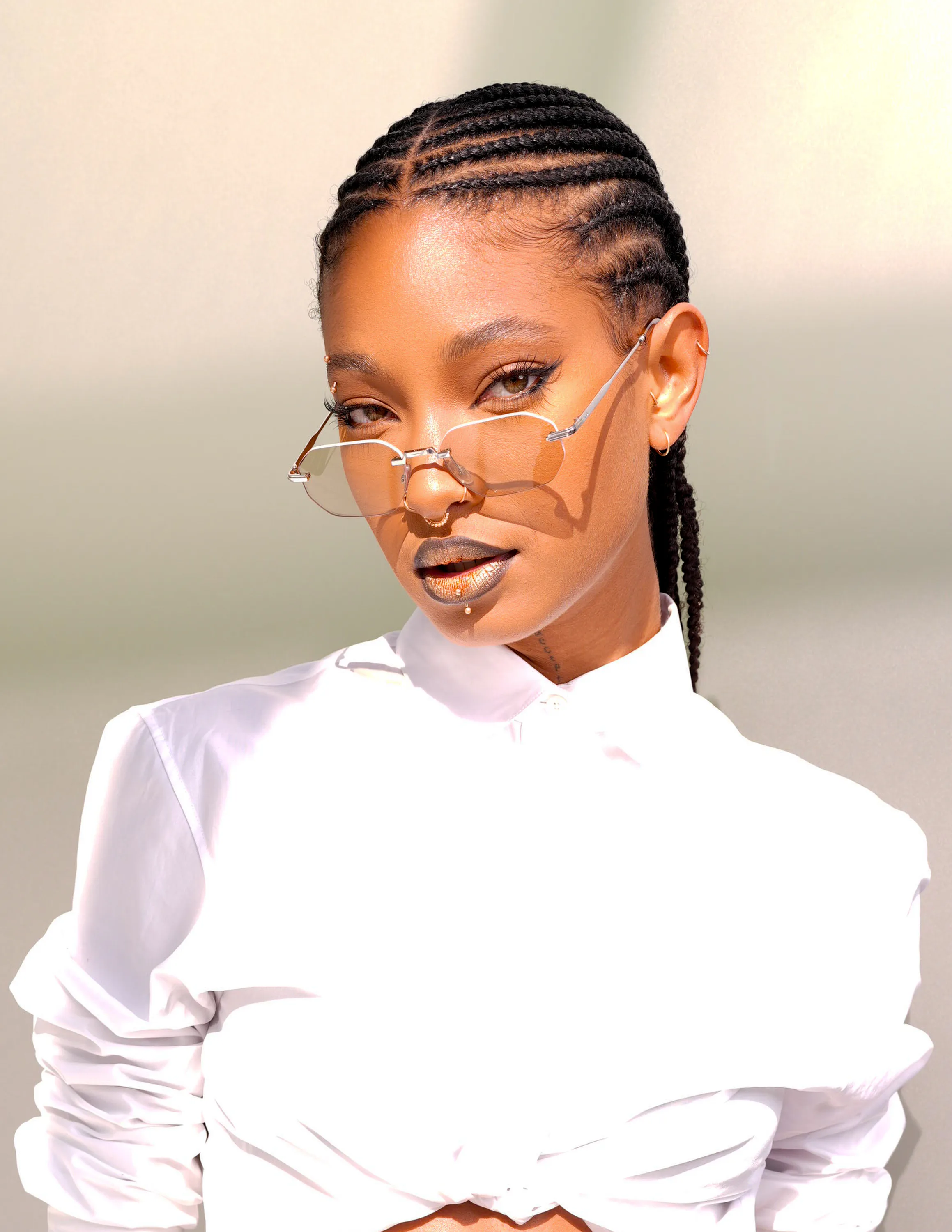 Willow Smith at the Dior fashion show with cool braids and lipstick