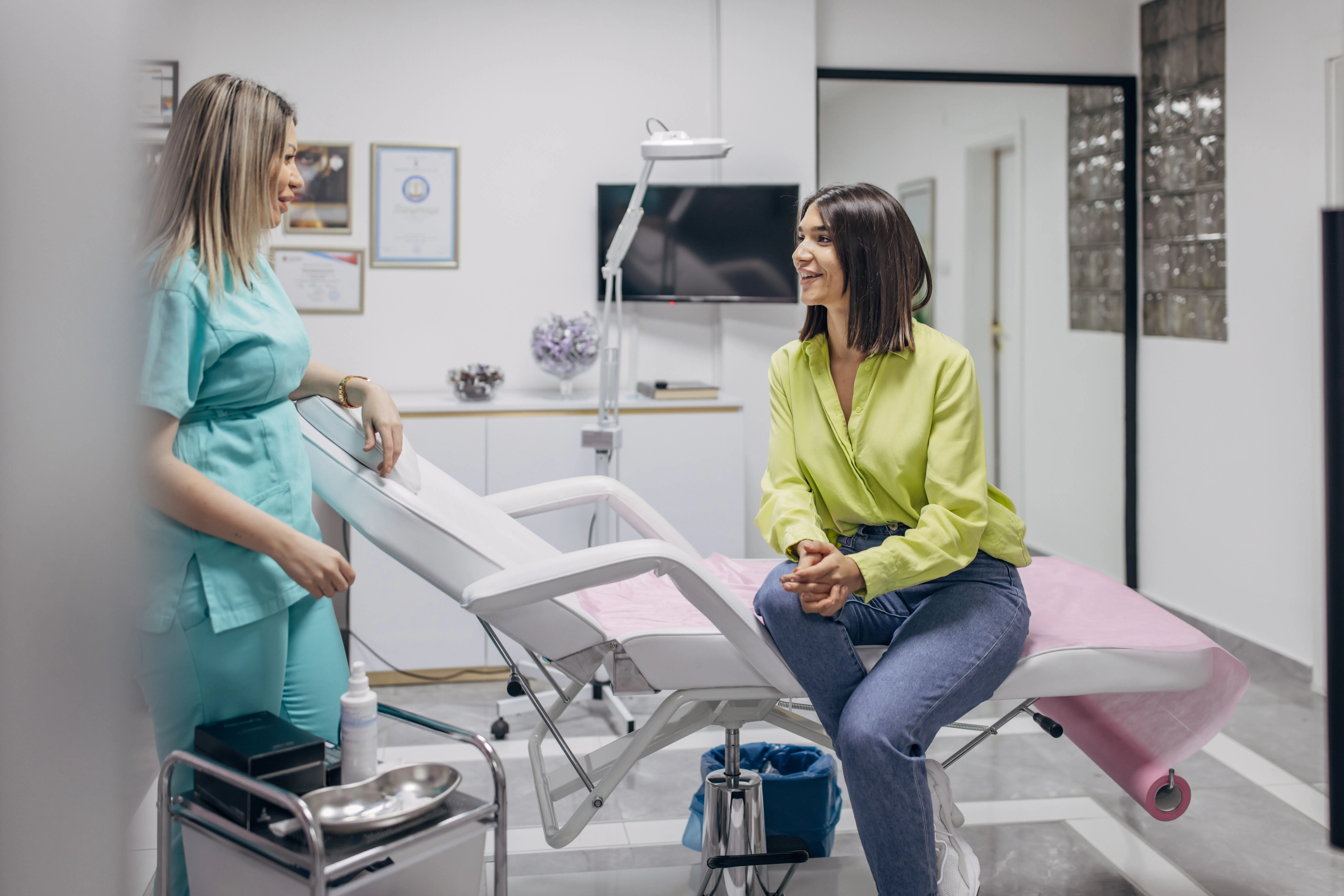A woman talking with her doctor in a medical office.