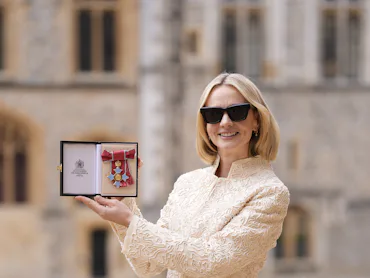 Actress Carey Mulligan poses after being made a Commander of the Order of the British Empire (CBE) a...