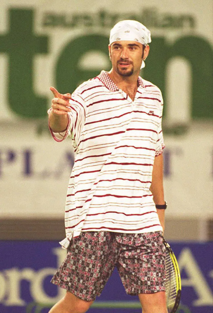 MELBOURNE, AUSTRALIA - JANUARY 15:  Andre Agassi of the US models his new look during a warm-up matc...