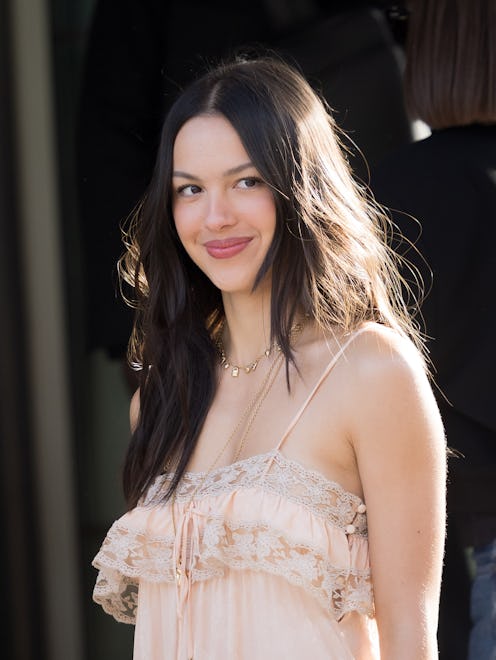 Olivia Rodrigo outside the Chloe Fall/Winter 2026 show with a middle part