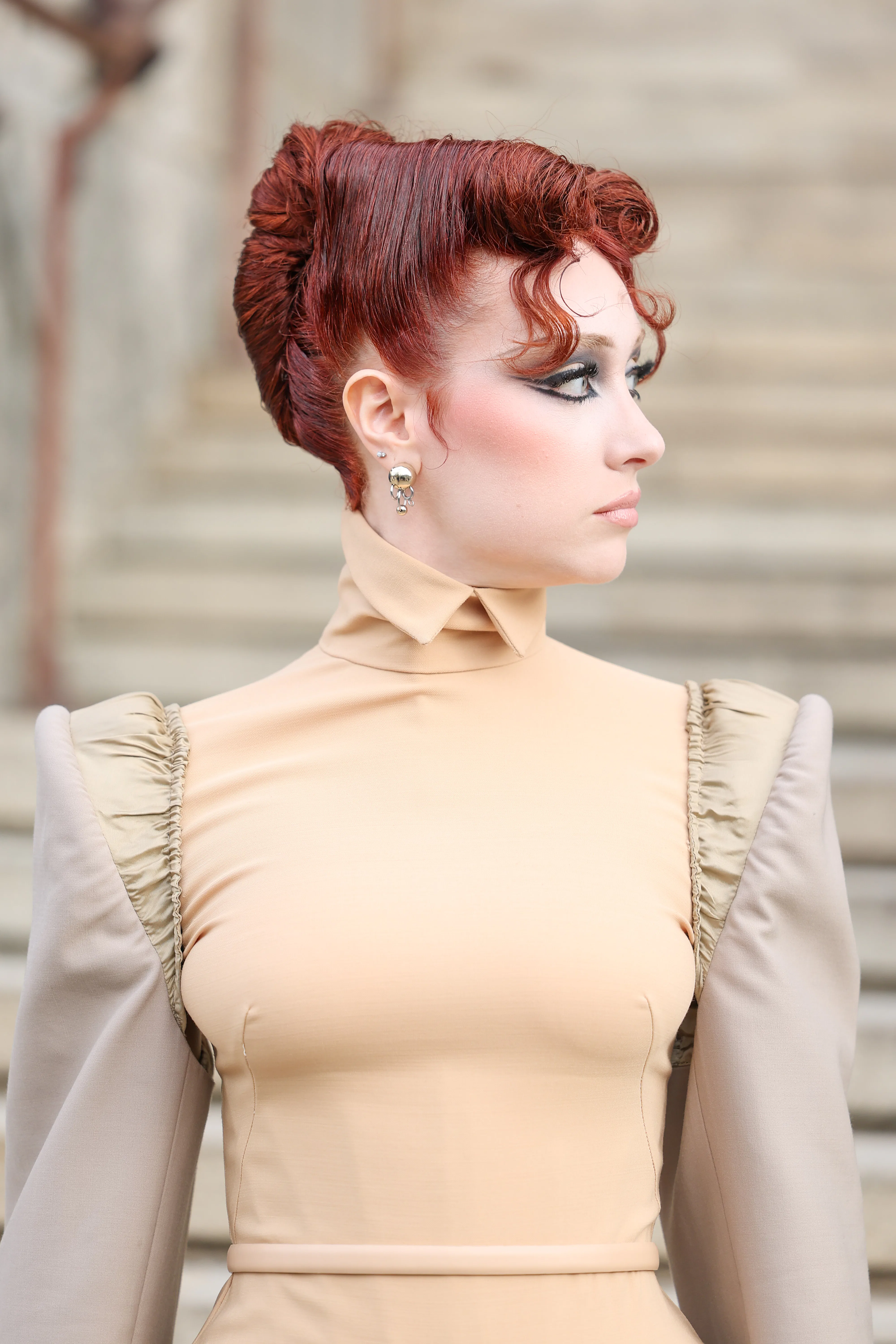 Chappell Roan's diva roll french twist, seen in profile