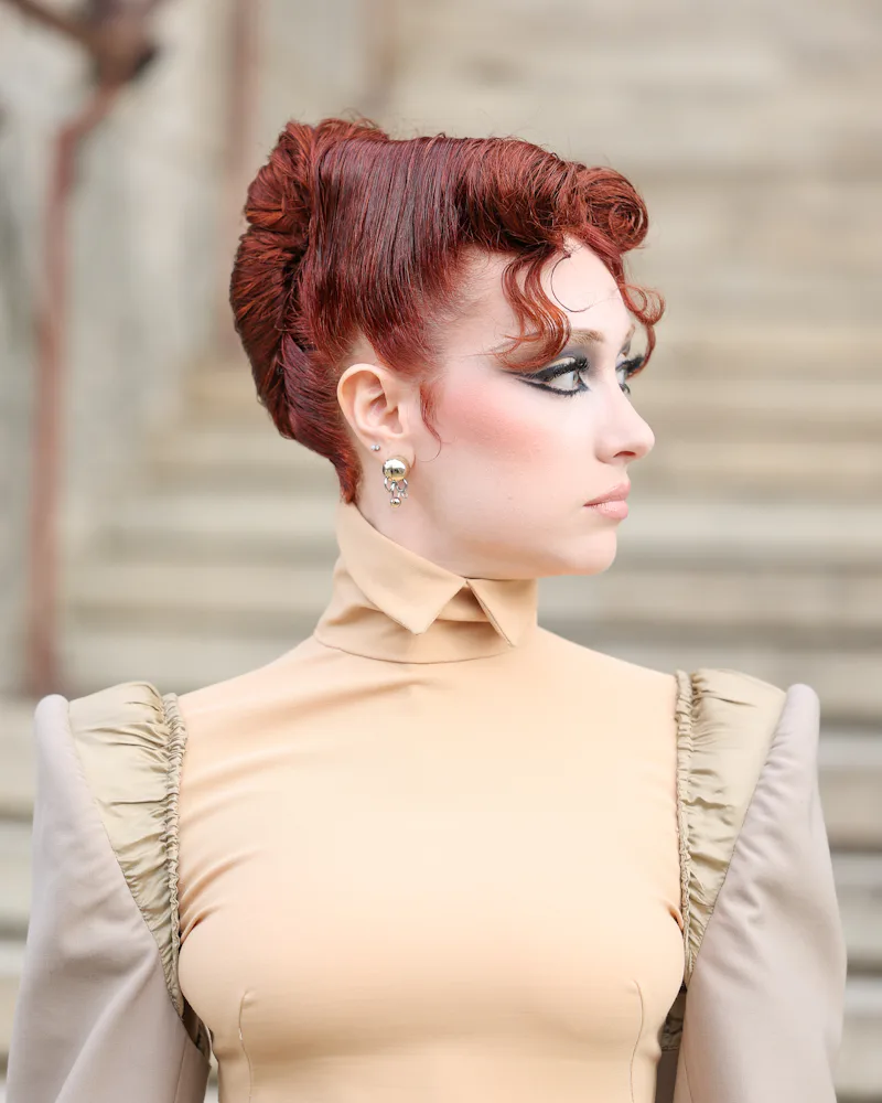 Chappell Roan's diva roll french twist, seen in profile