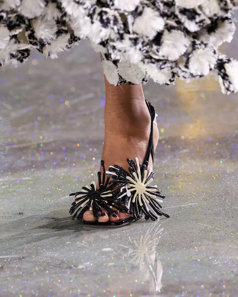 A model, shoe detail, walks the runway during the Chanel Womenswear Fall/Winter 2026