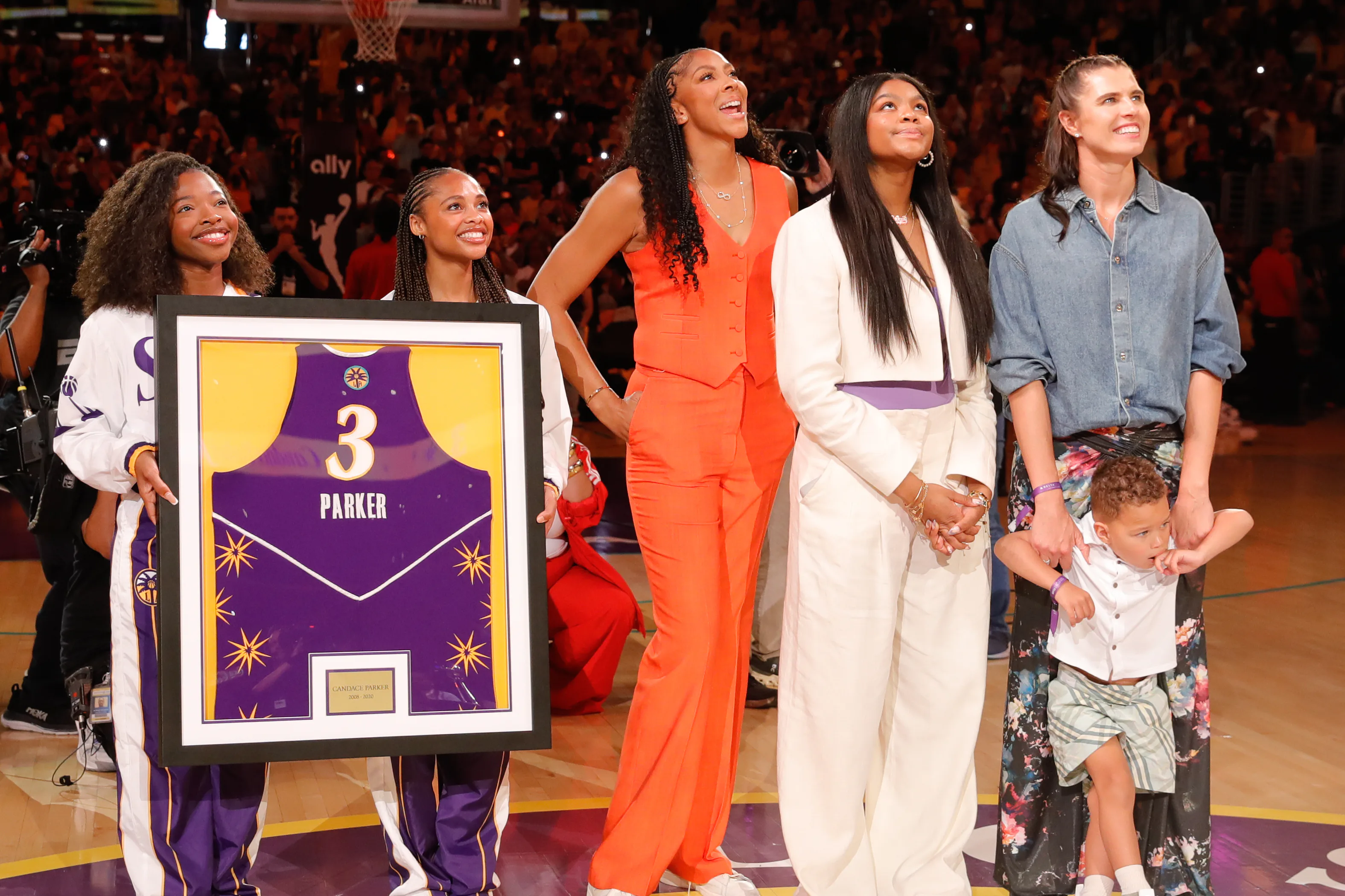 Former Los Angeles Sparks player Candace Parker smiles for her Jersey Retirement ceremony standing h...