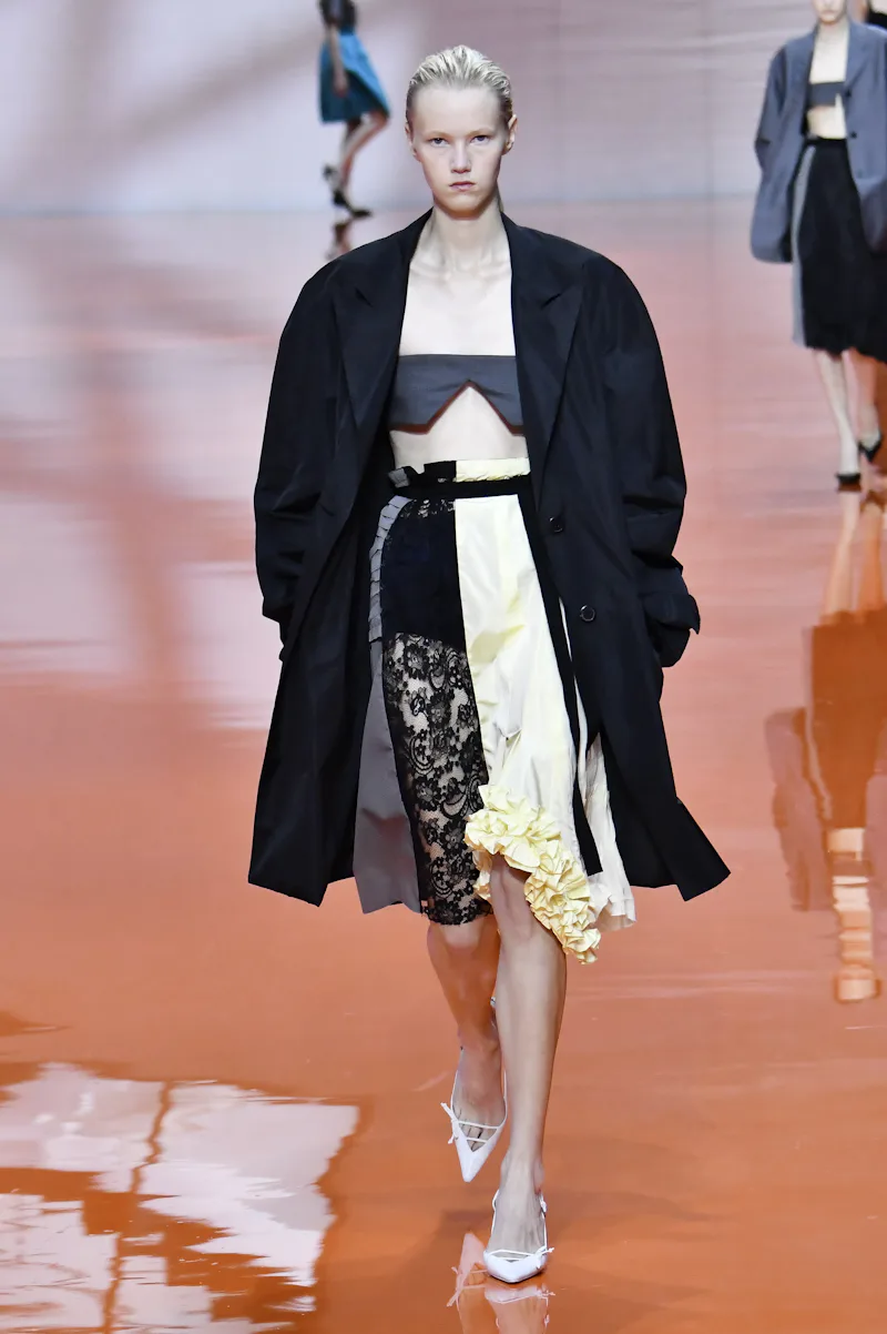 MILAN, ITALY - SEPTEMBER 25: A model walks the runway during the Prada Ready to Wear Spring/Summer 2...