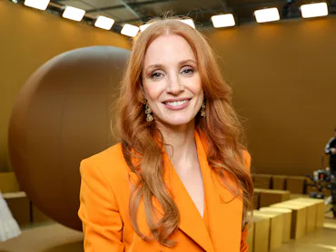 Jessica Chastain with long red hair at Paris Fashion Week