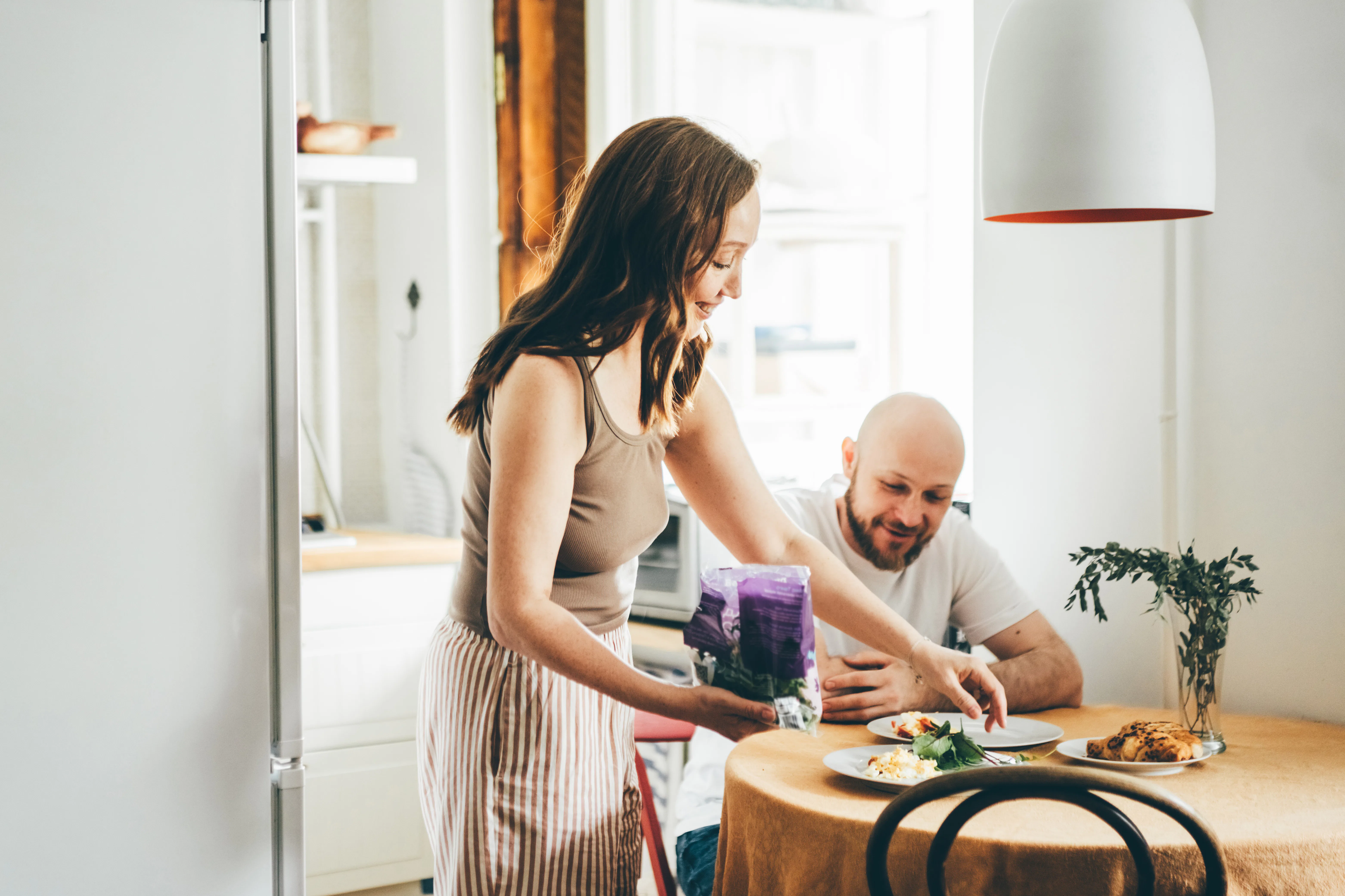 The couple is having breakfast together.