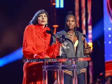 LOS ANGELES, CALIFORNIA - MARCH 17: (FOR EDITORIAL USE ONLY) (L-R) Lady Gaga accepts the Innovator A...