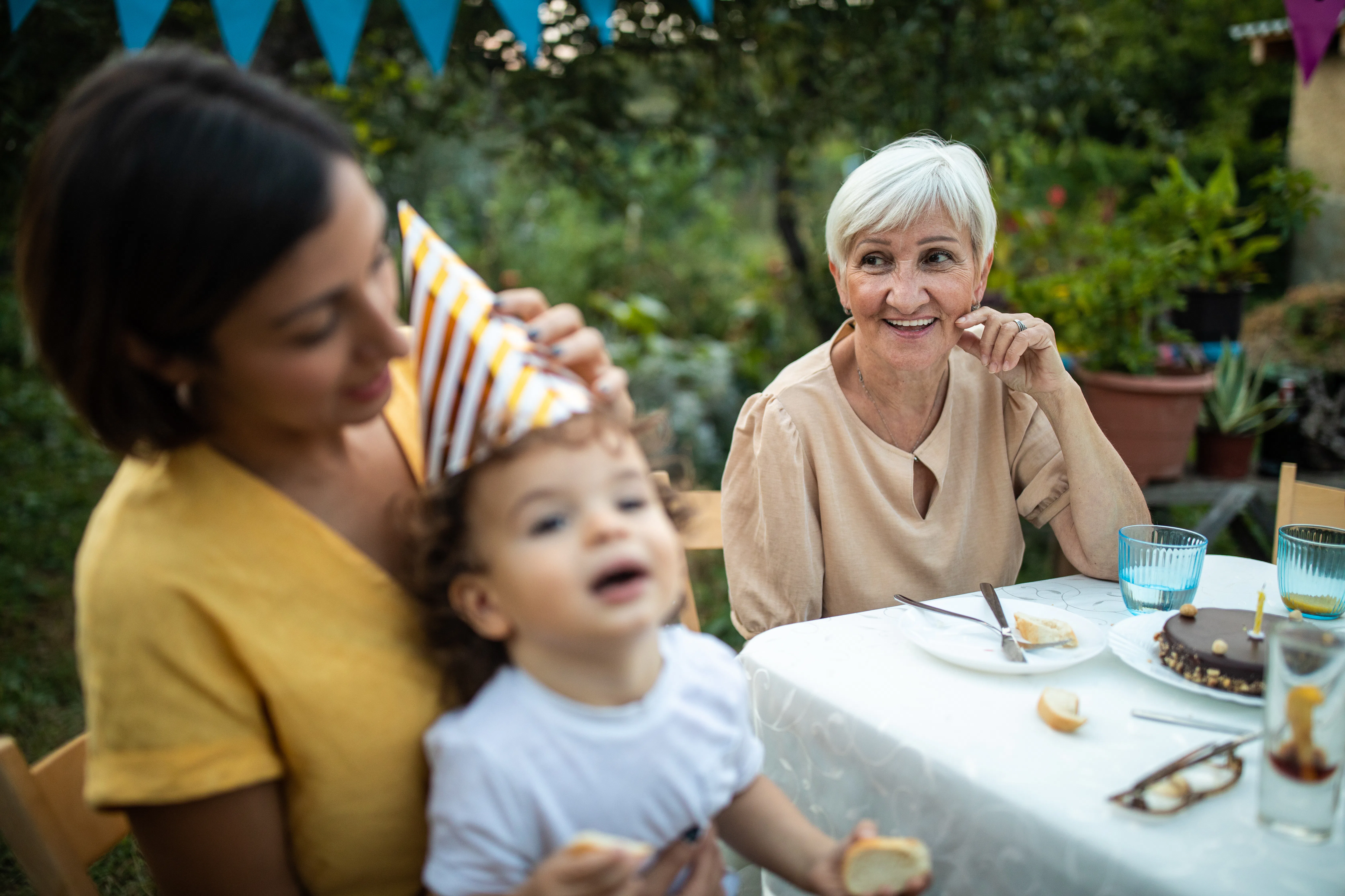 Grandmother and her offspring on birthday party at backyard