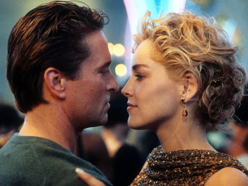 Michael Douglas and Sharon Stone dancing in scene from the film 'Basic Instinct', 1992. (Photo by Tr...