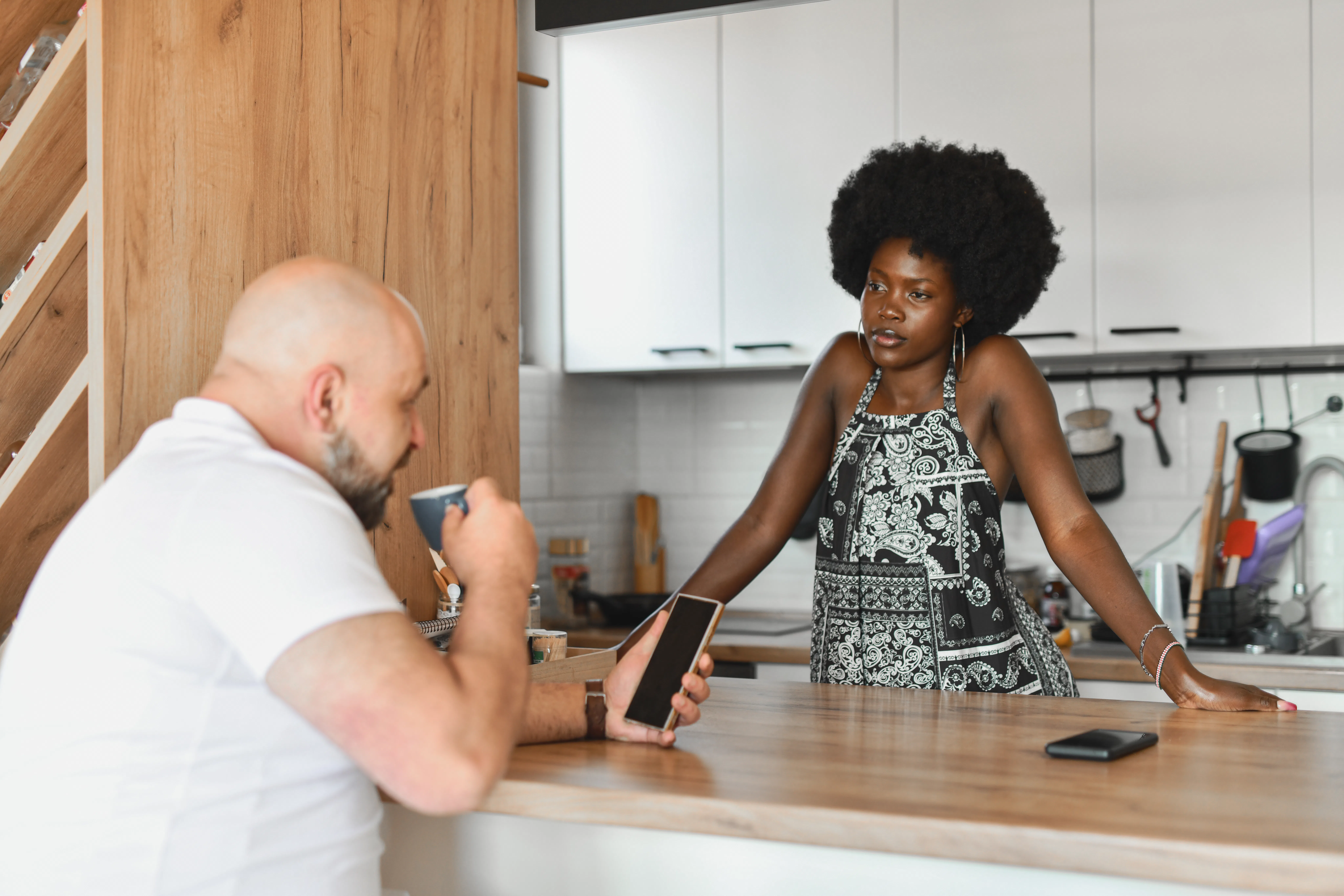 Beautiful Female Looking Angry Talking to Boyfriend and He's Looking at His Phone Ignoring Her