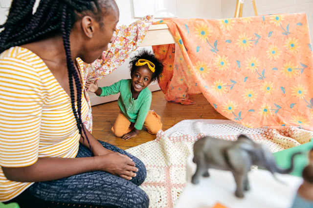 Mother and daughter playing hide and seek