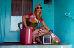 Lisa Kudrow crouching down in a scene from the film 'Romy And Michele's High School Reunion', 1997. ...