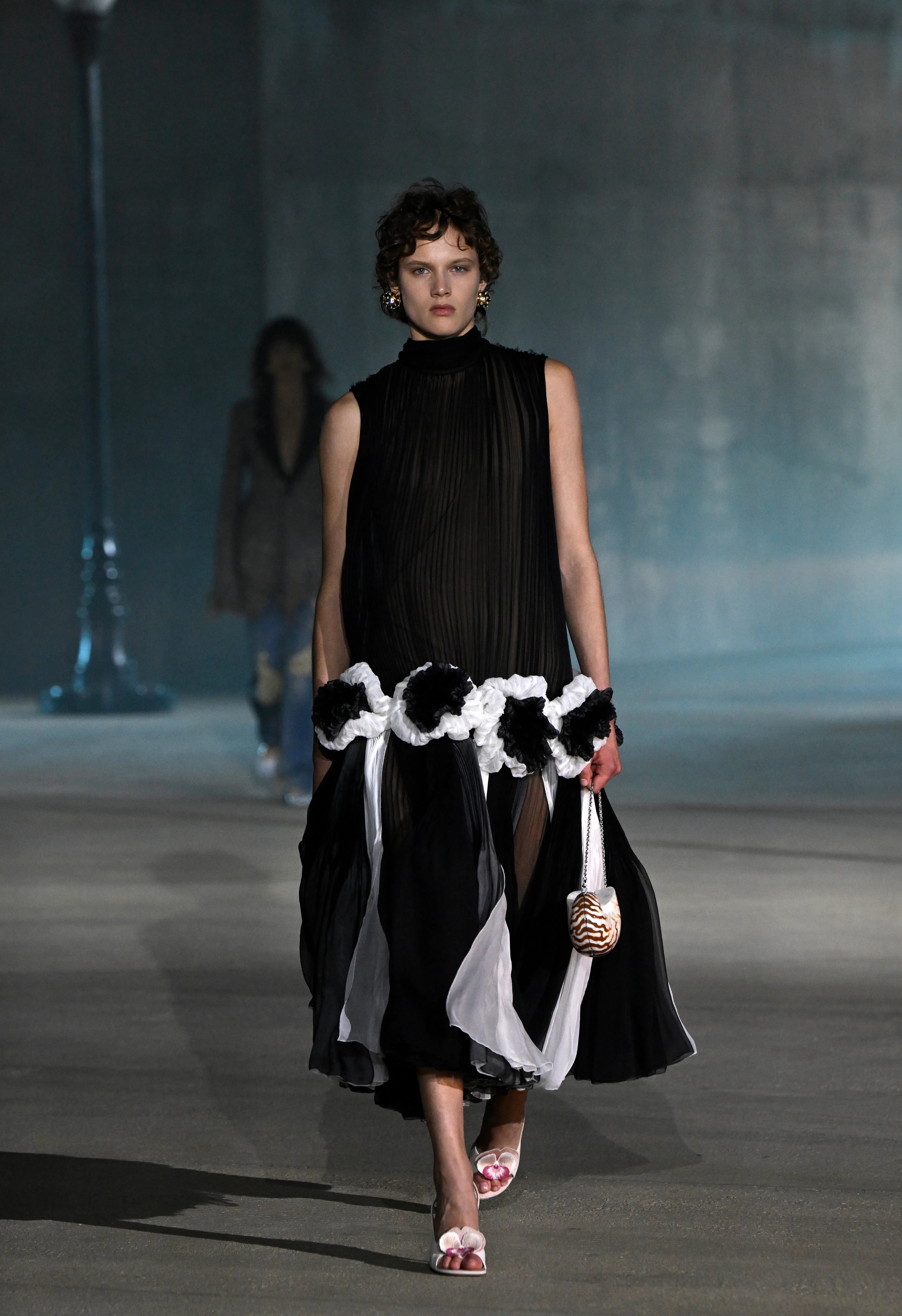 A model walks the runway at the Dior 2027 Cruise Collection Show