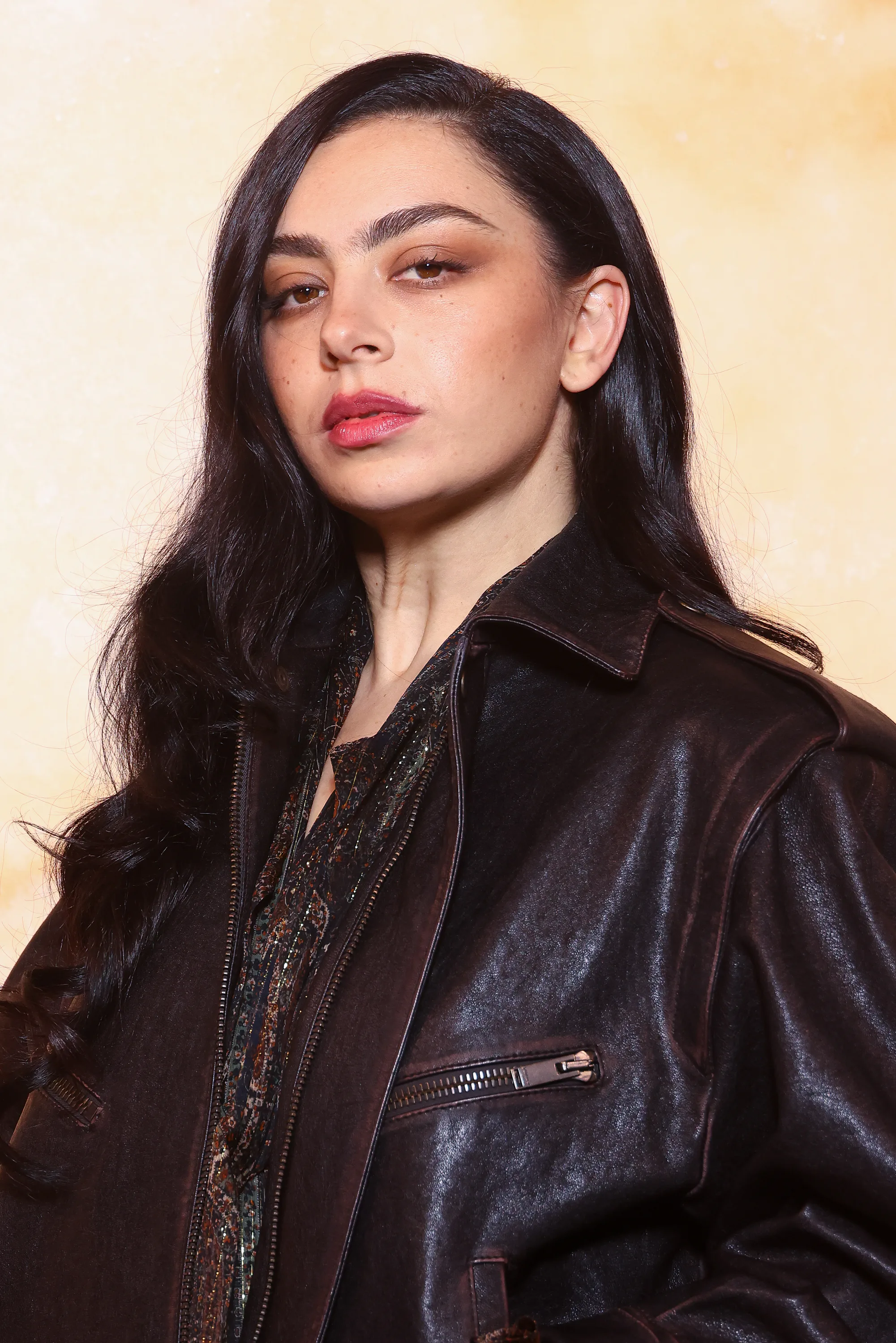 Charli XCX at a Saint Laurent show with pretty diffused makeup