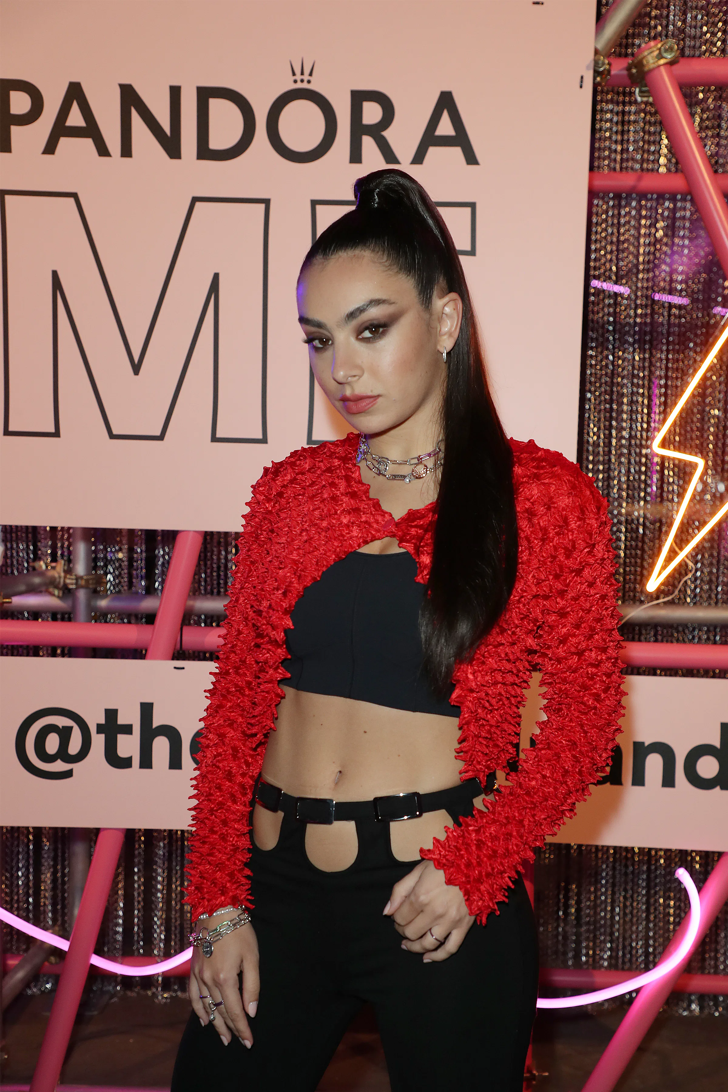 Charli XCX with a snatched high ponytail and snatched smoky eyeshadow