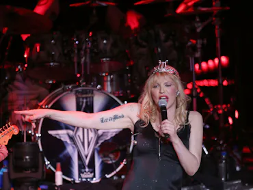 HOLMDEL, NJ - AUGUST 02: Courtney Love joins Billy Corgan of Smashing Pumpkins on stage during thei...