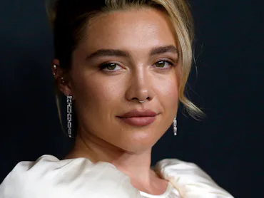 Florence Pugh with an formal updo at an event
