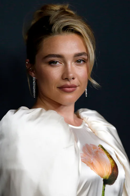 Florence Pugh with an formal updo at an event