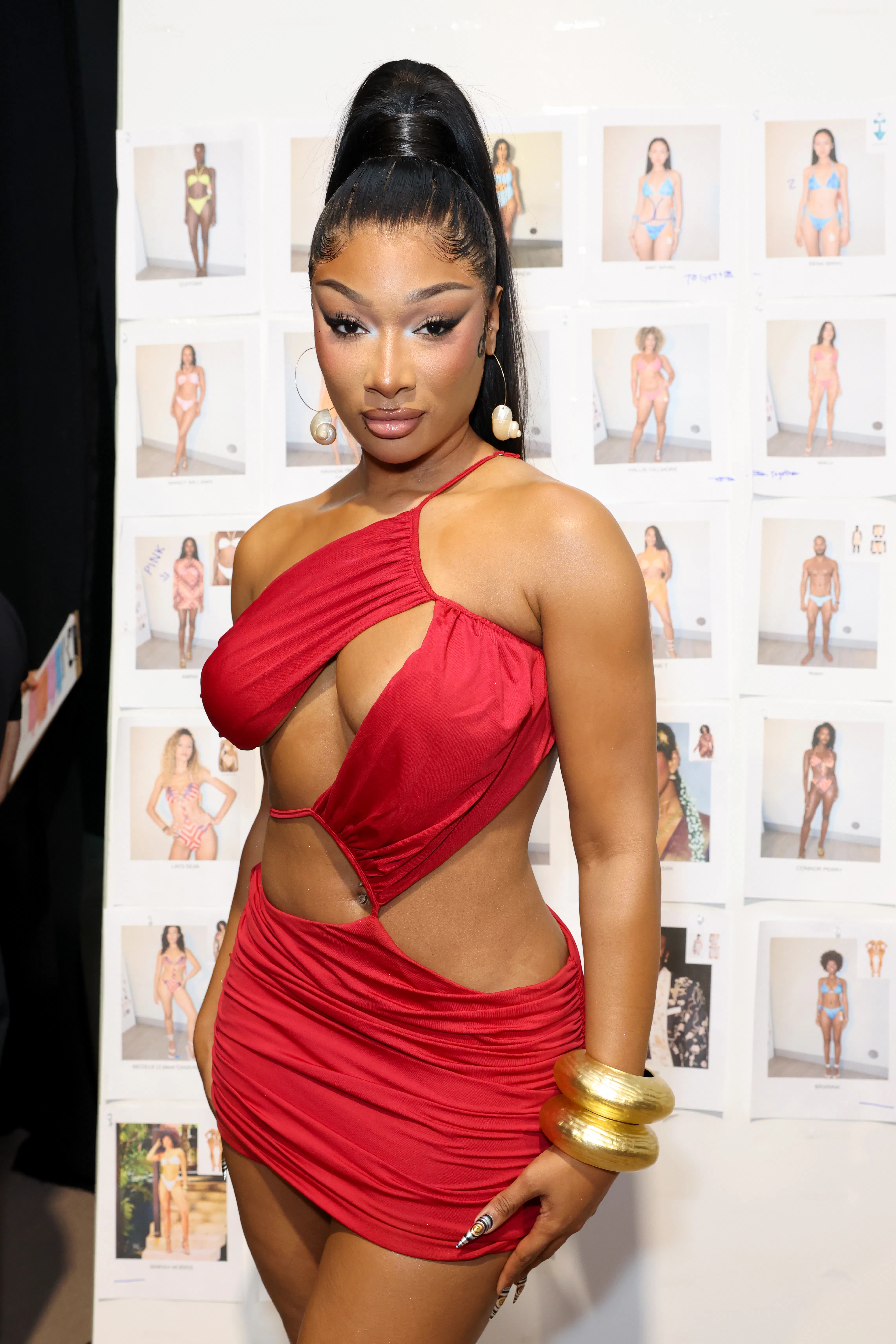 Megan Thee Stallion backstage at the Hot Girl Summer show with a snatched ponytail and eyeliner